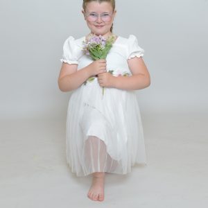girl in white wedding dress holding a flower boquet