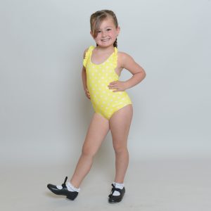 little girl in yellow pokadot swinsuit